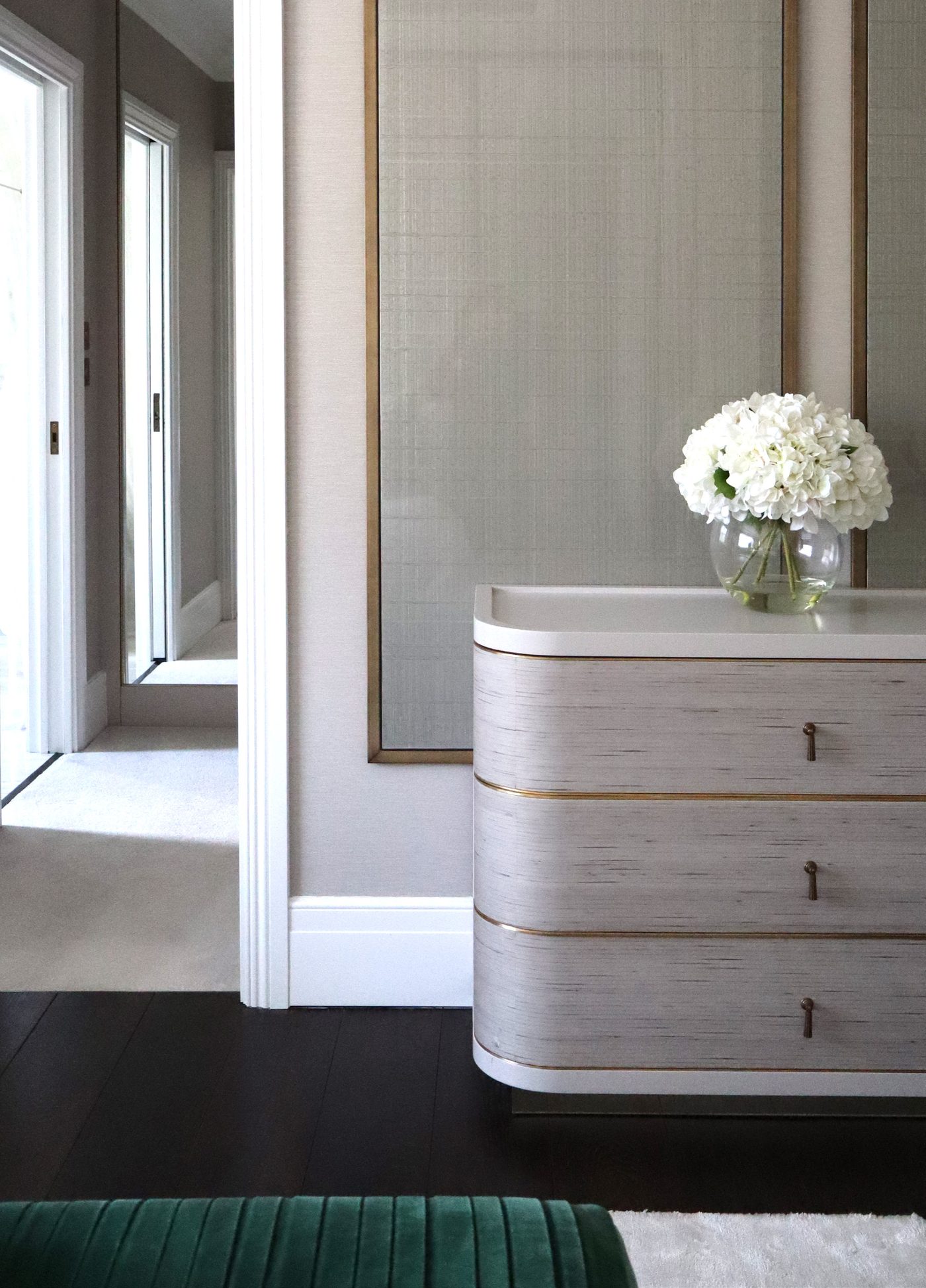 Curved chest of drawers with antique brass trim